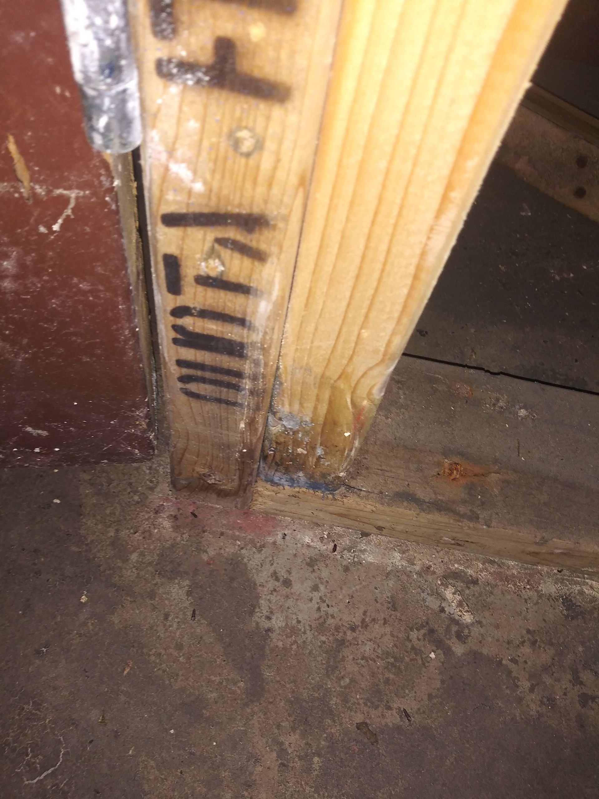 A close up of a wooden beam in a room.