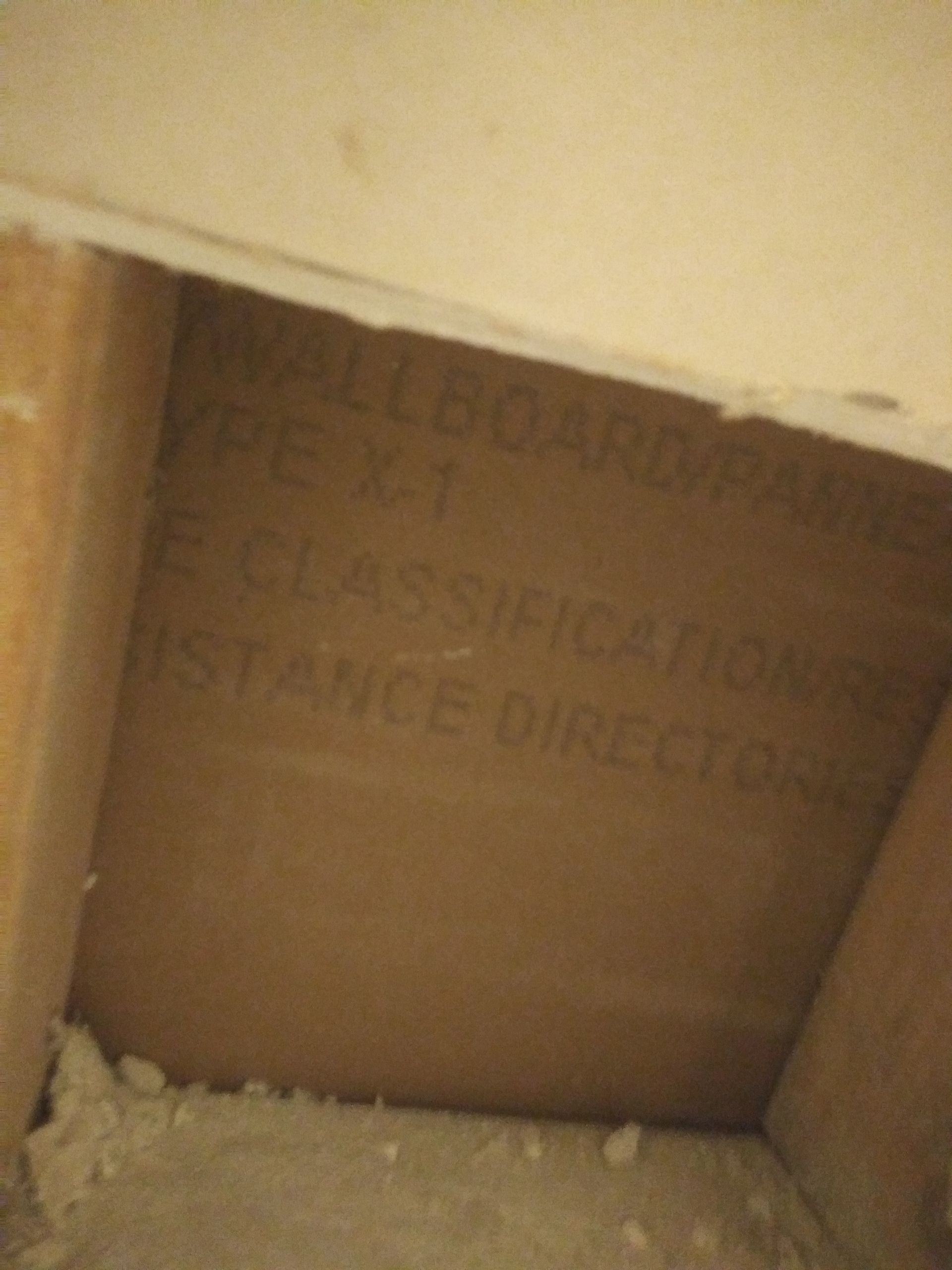 A room with a wallboard that says 