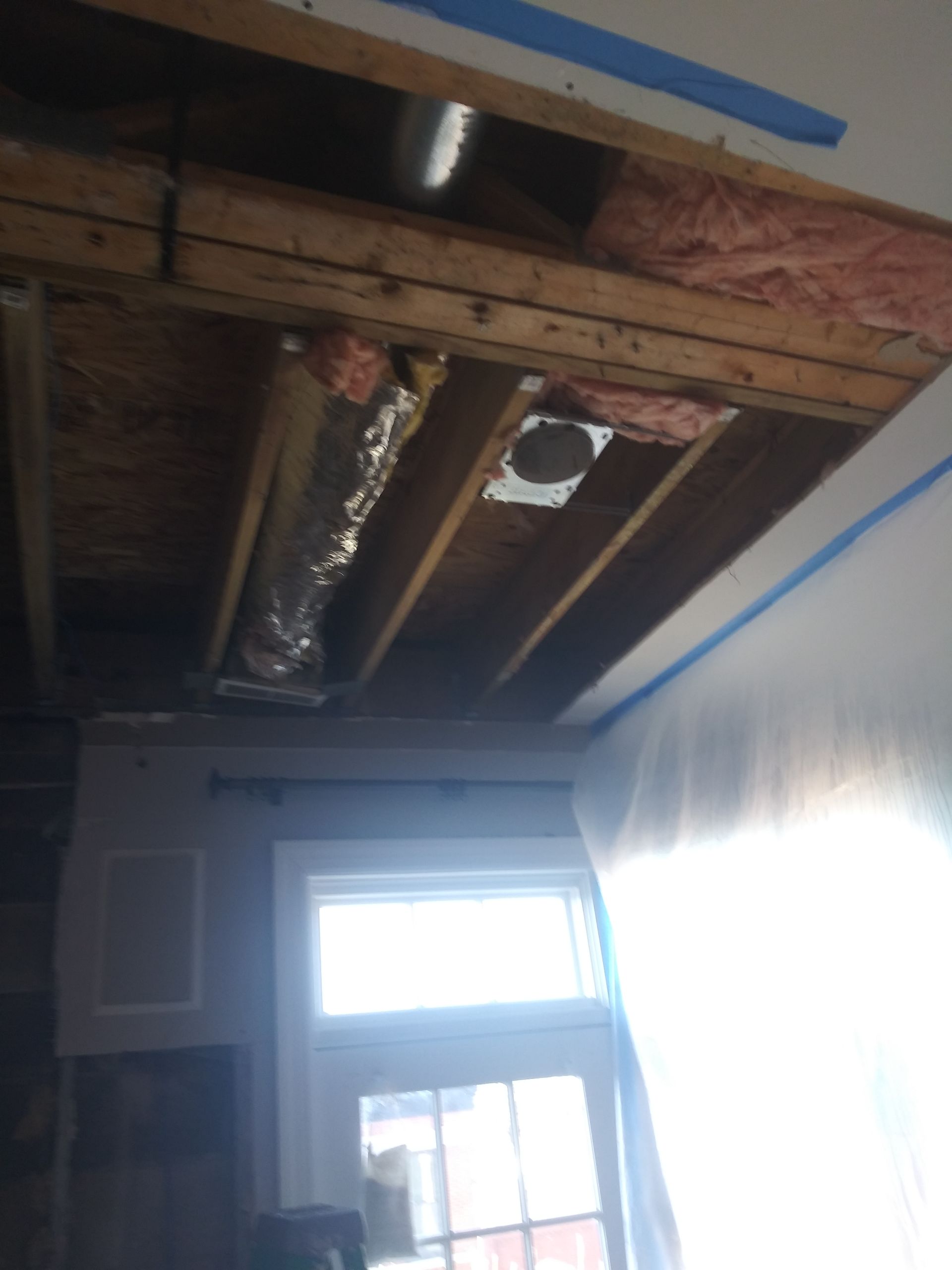 A room with a ceiling that is being remodeled