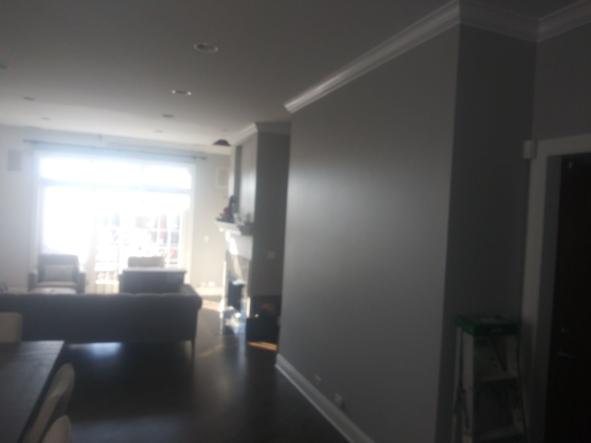 A living room with a couch and chairs in it