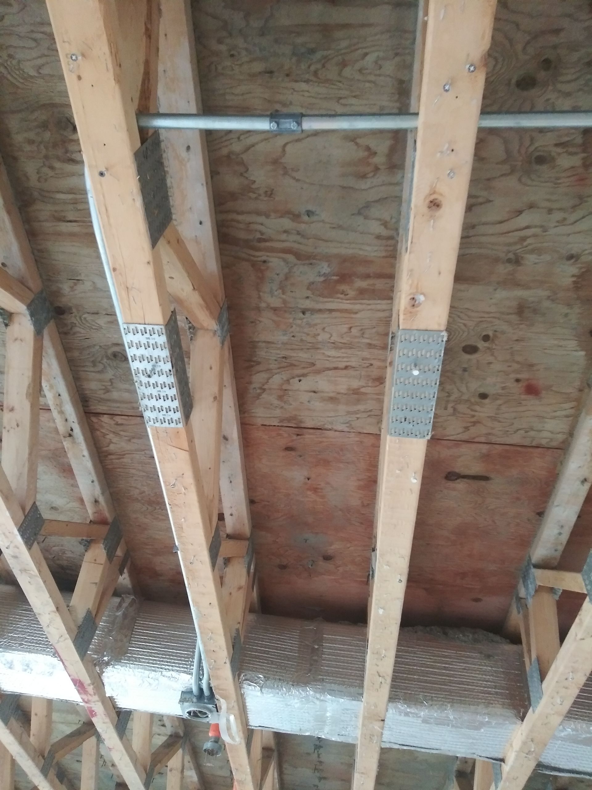 A close up of the ceiling of a house under construction.