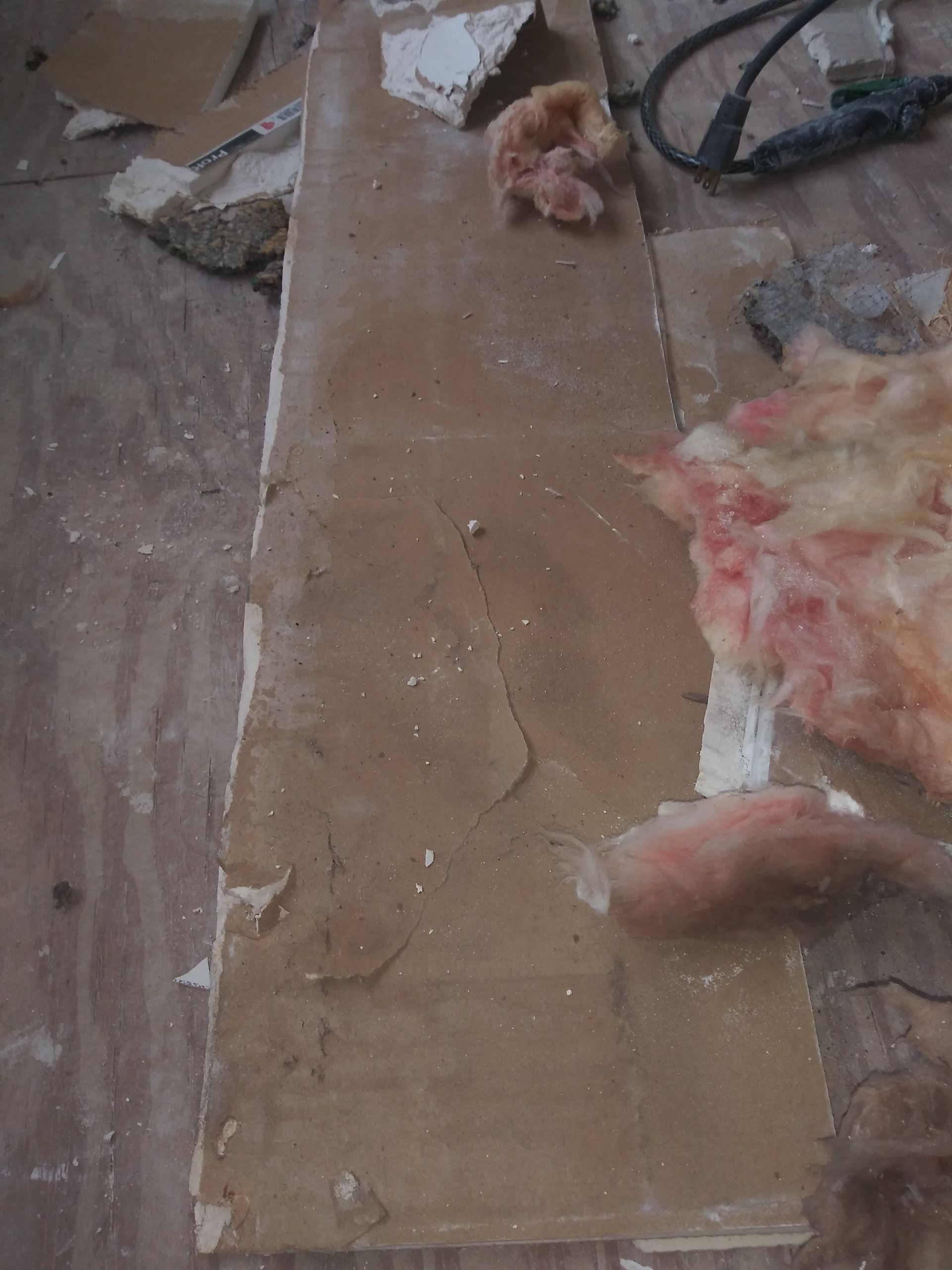 A piece of cardboard is laying on a wooden table.