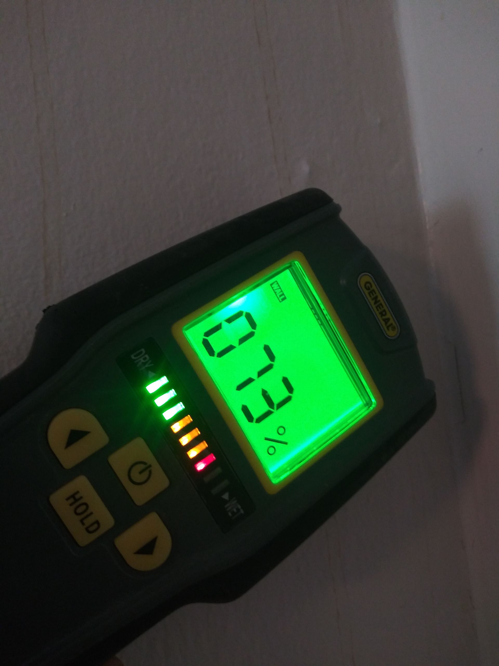 A digital device with a green screen that says 33.3 %