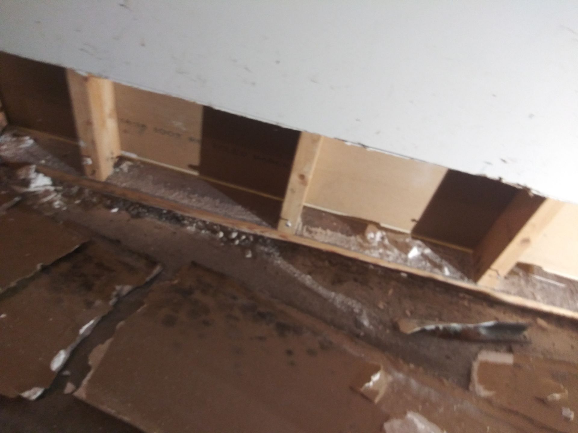 A hole in a wall with a few holes in it