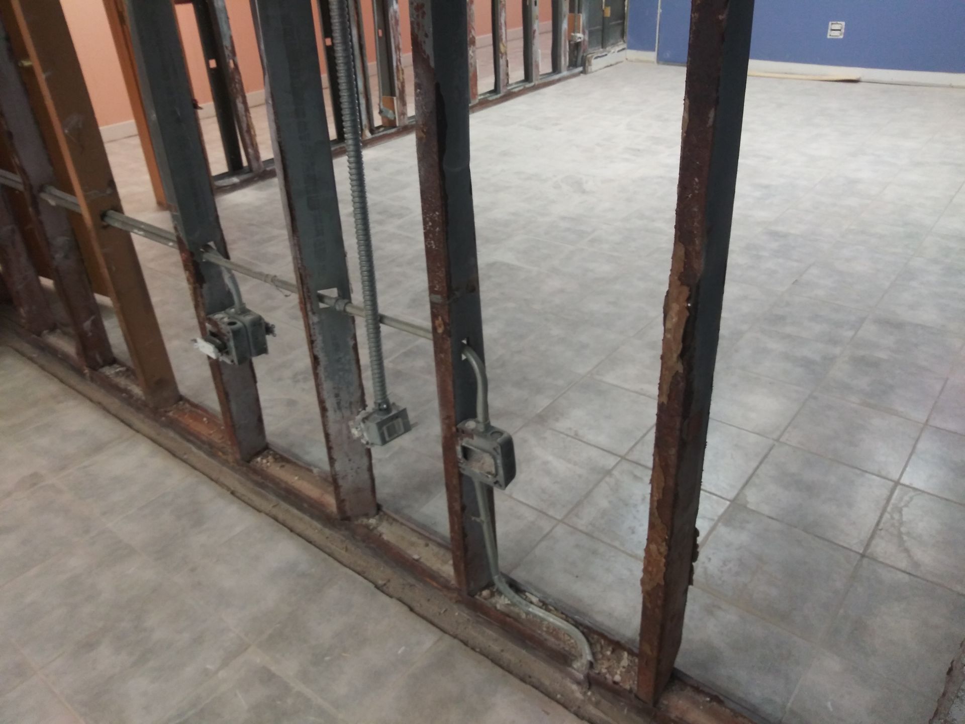 A room with a wooden frame and tile floor