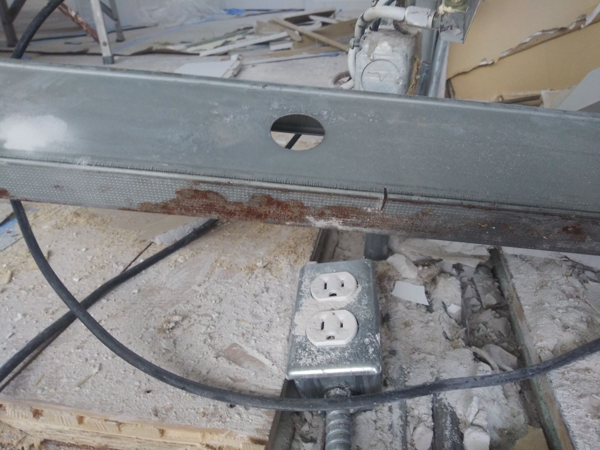 A metal box with three electrical outlets on it