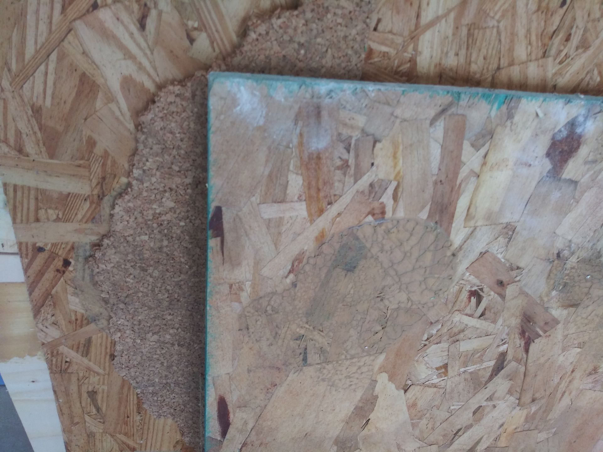 A close up of a piece of plywood on a table.