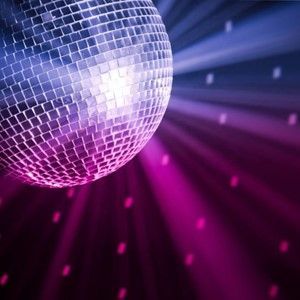 Silver disco ball with pink and purple light beams in a dark party scene