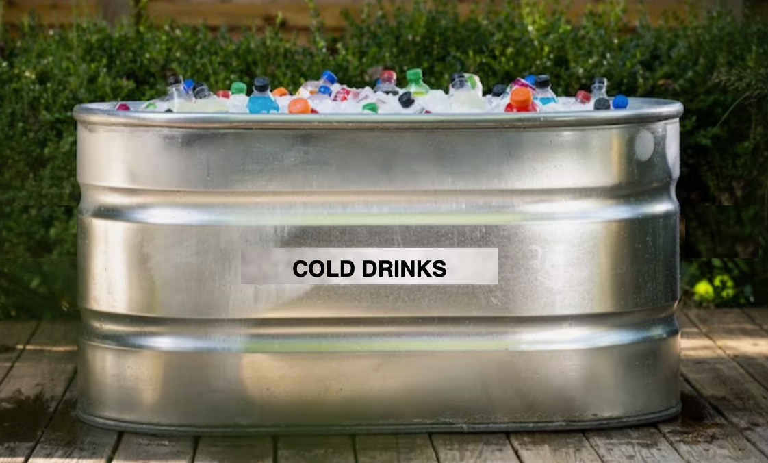 Stainless steel tub labeled “COLD DRINKS” filled with ice and bottled drinks outdoors.