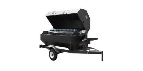 Black trailer-mounted metal smoker grill with lid open on a wheeled frame