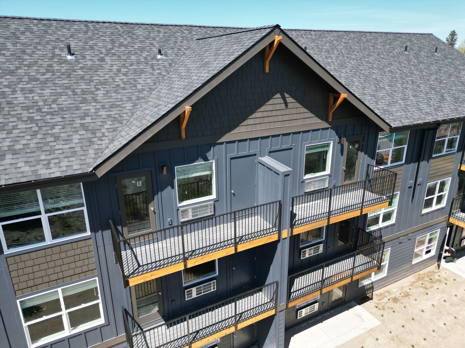 An aerial view of a large apartment building with balconies.