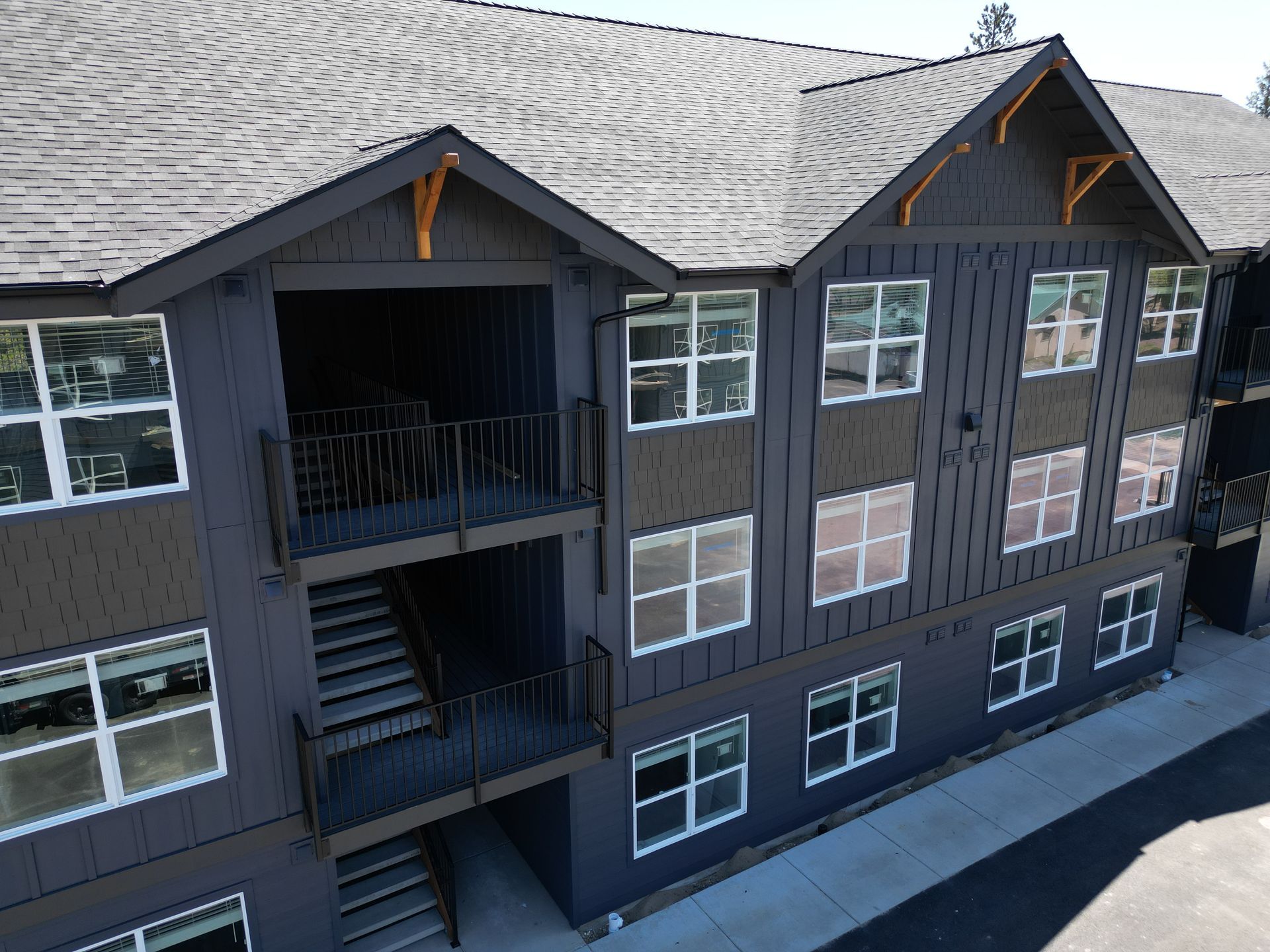 An aerial view of a large apartment building with stairs and balconies.