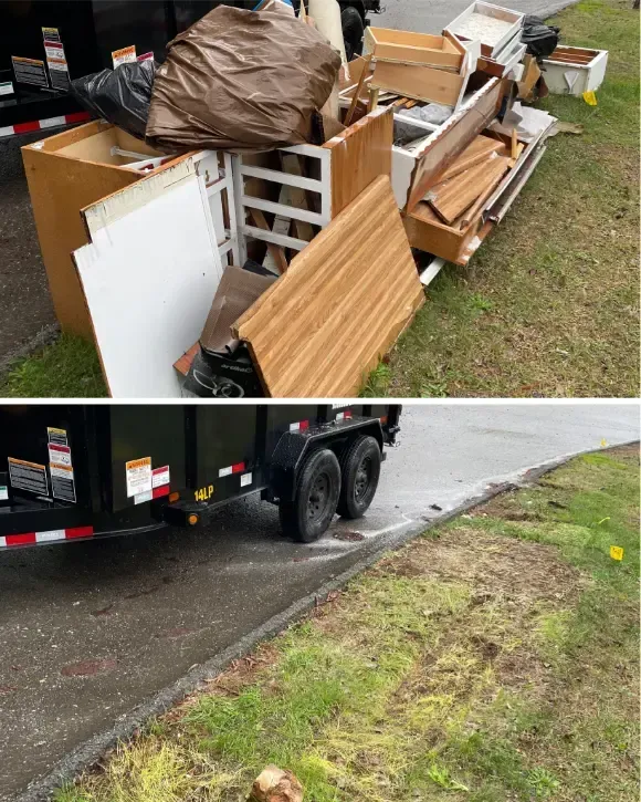 A dumpster filled with junk is parked on the side of the road.