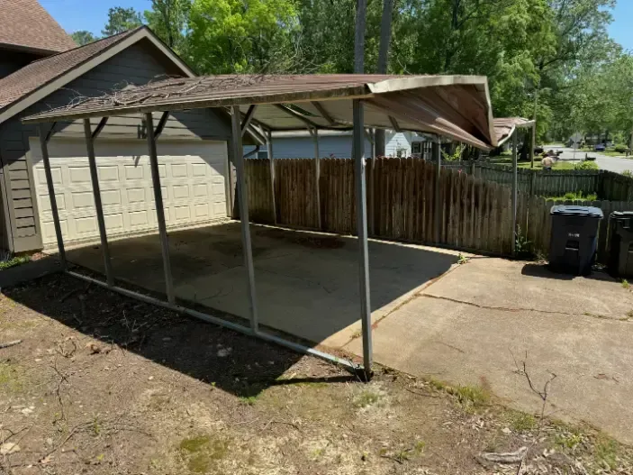 There is a carport in the backyard before demolition