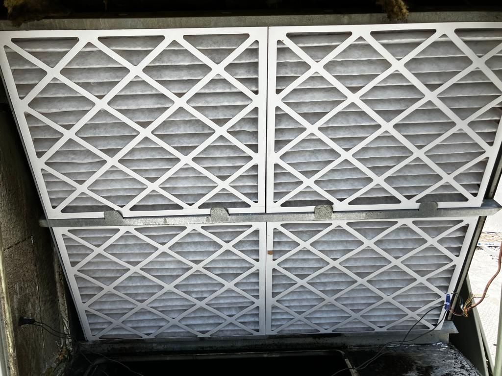 A bunch of air filters are stacked on top of each other.