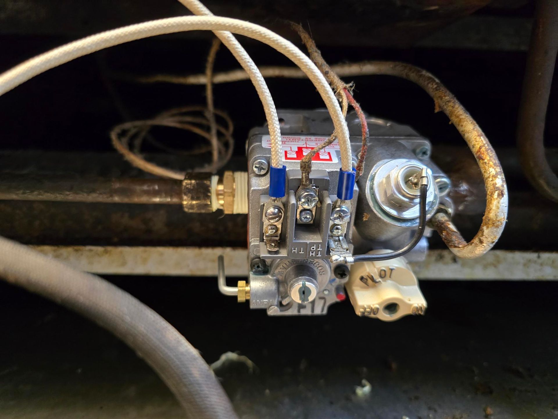 A close up of a gas valve on a stove