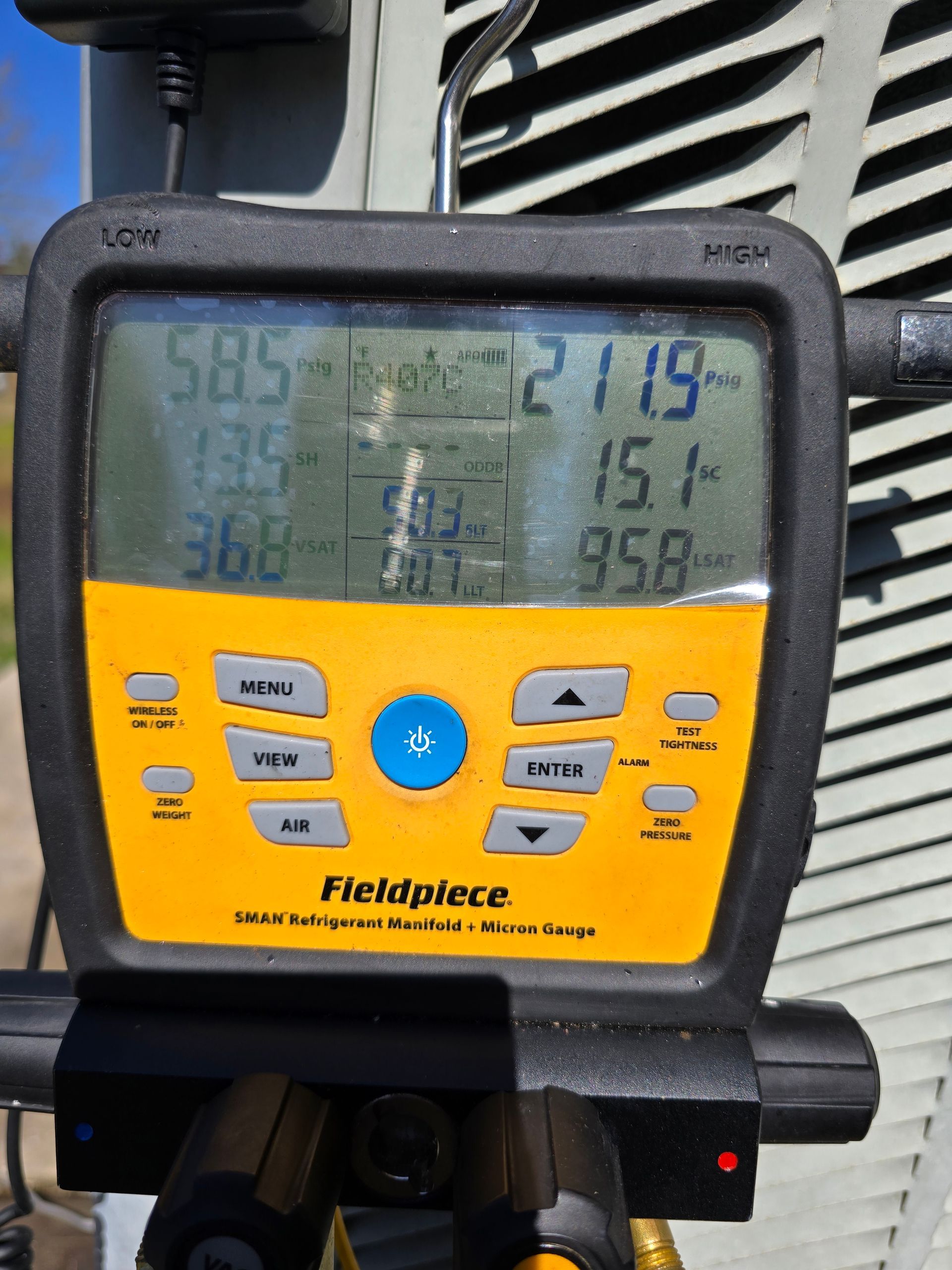 A fieldpiece digital thermometer displays a temperature of 385 degrees