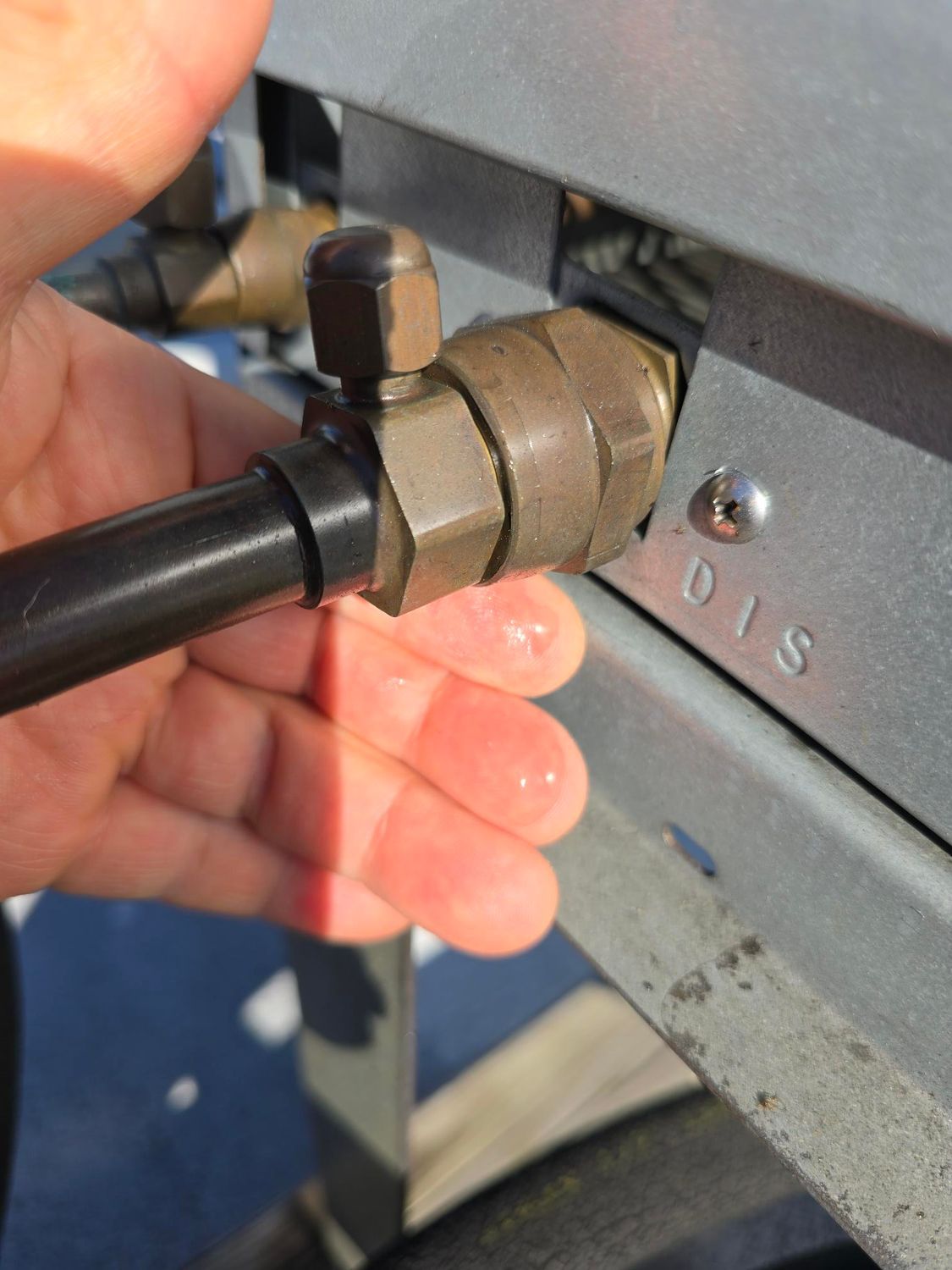 A person is holding a hose with the number 018 on it