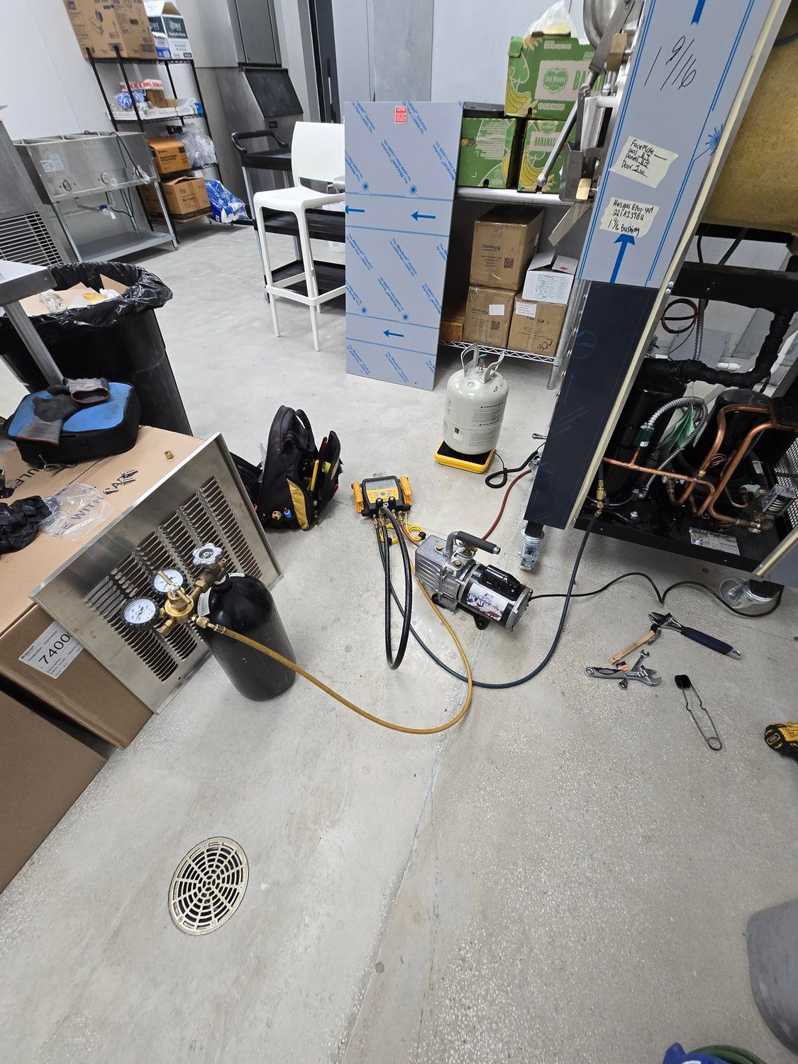 A room with a lot of tools and equipment on the floor.