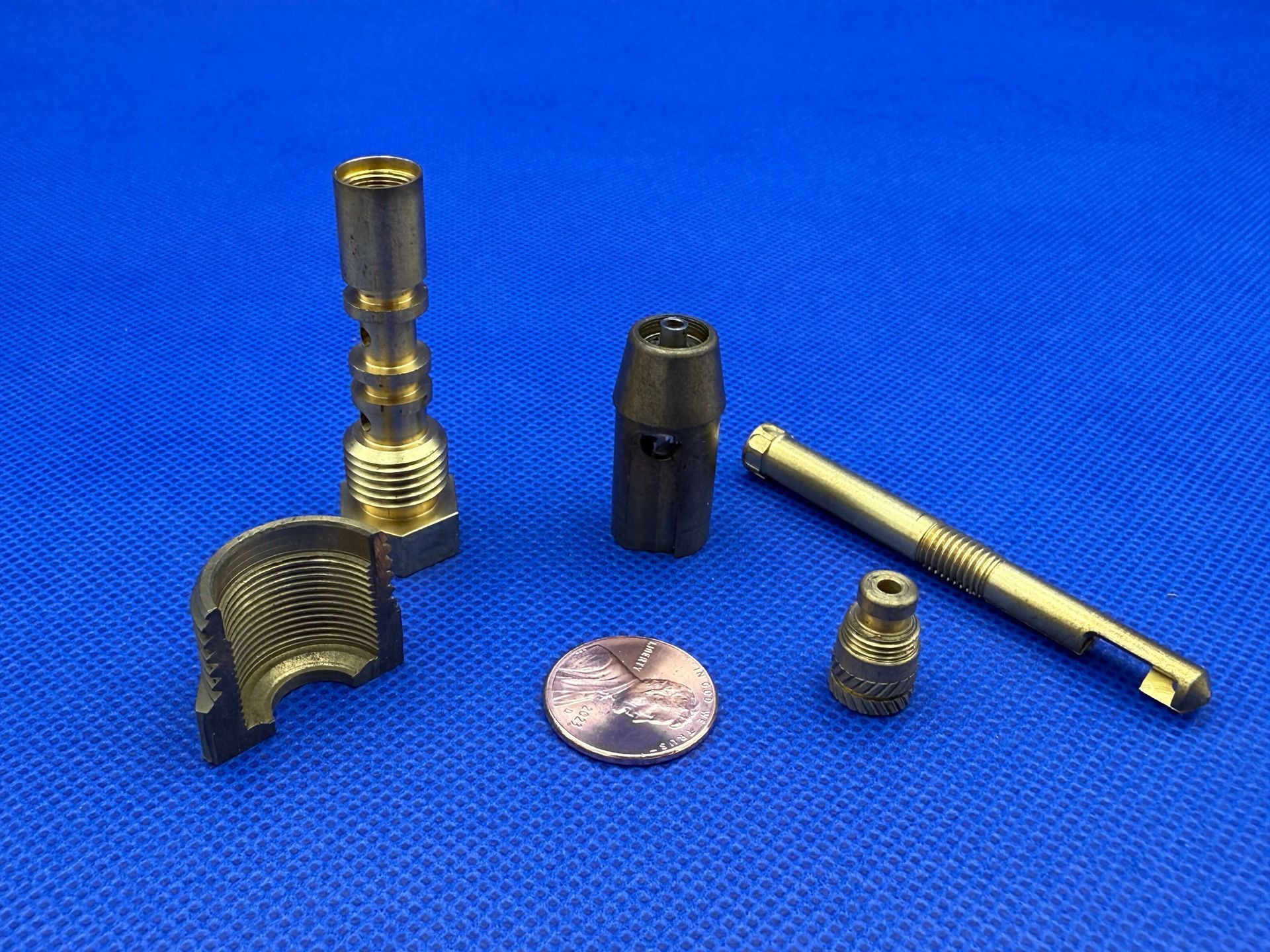 A bunch of brass rods are stacked on top of each other