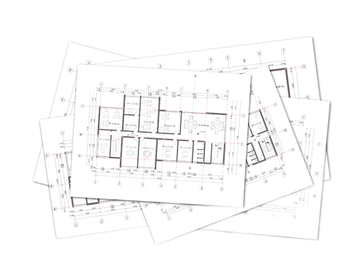 A stack of architectural floor plans with drawn layouts, grid lines, and dimensions on white paper.
