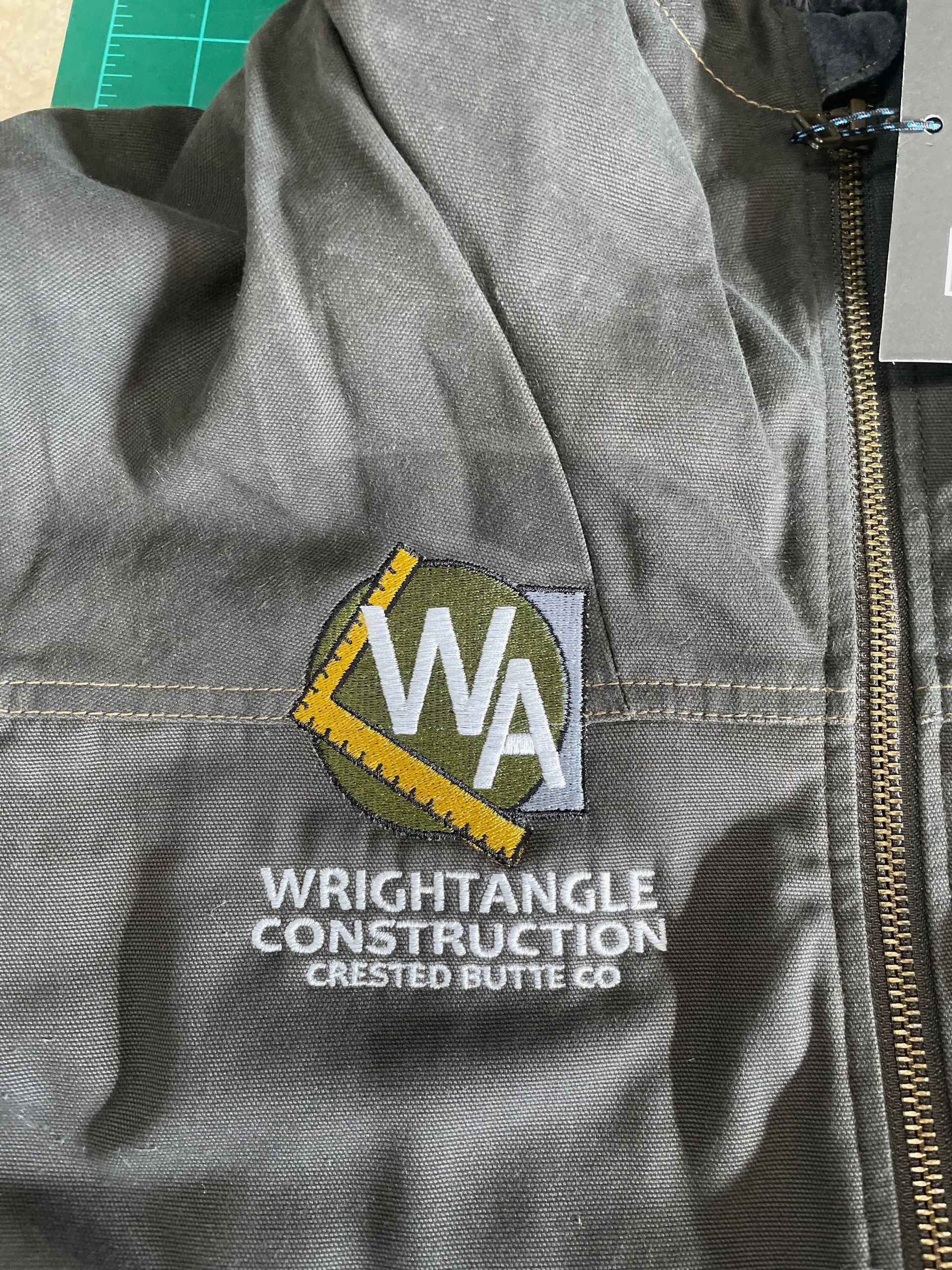 A close up of a jacket with a logo on it.