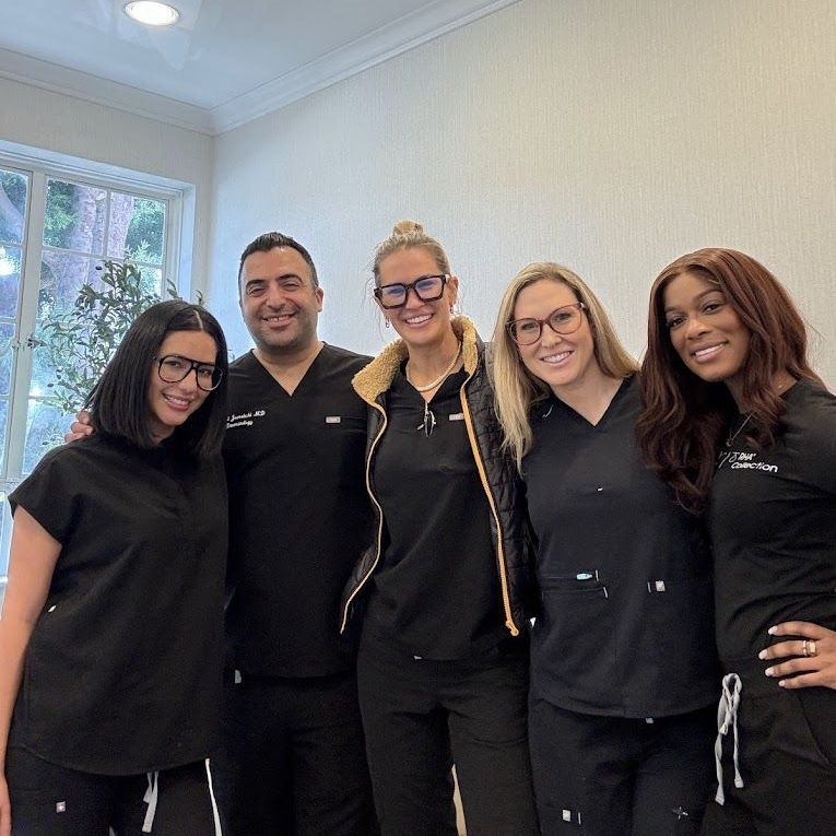 A group of nurses are posing for a picture together.