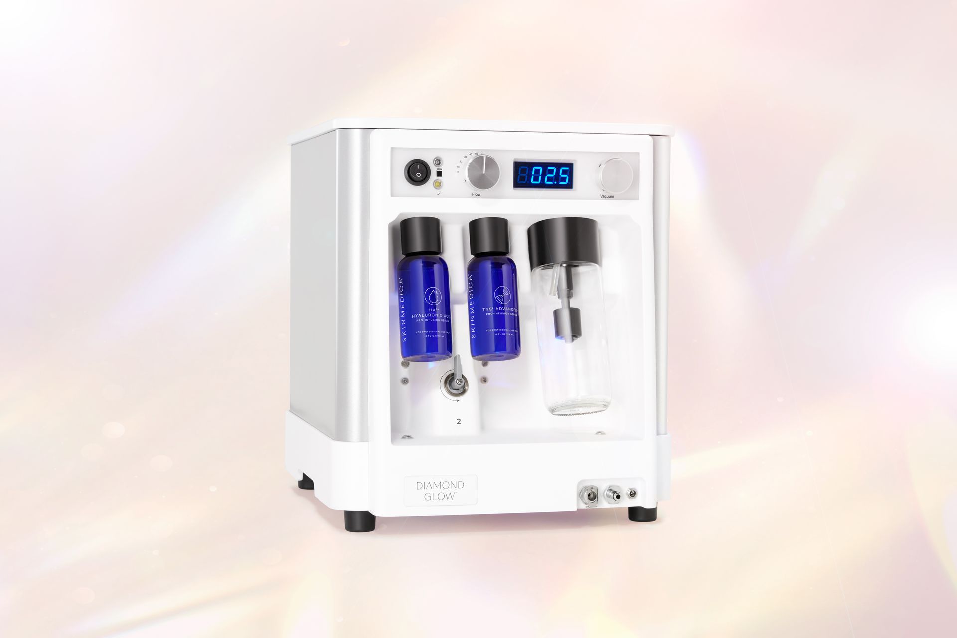 A white machine with two blue bottles inside of it.
