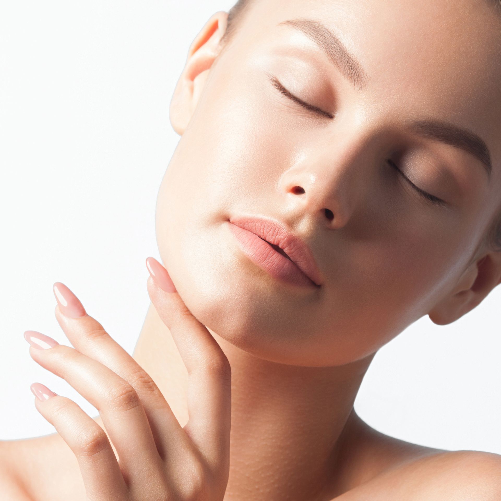 A close up of a woman 's face looking up at the sky.