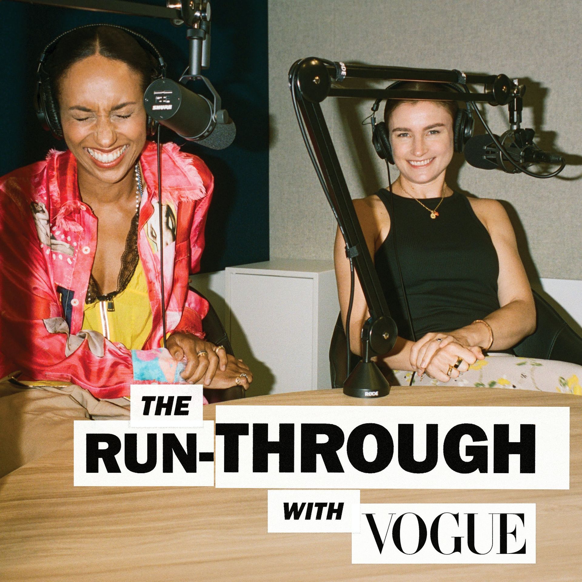 Two women are sitting in front of a microphone for the run through with vogue