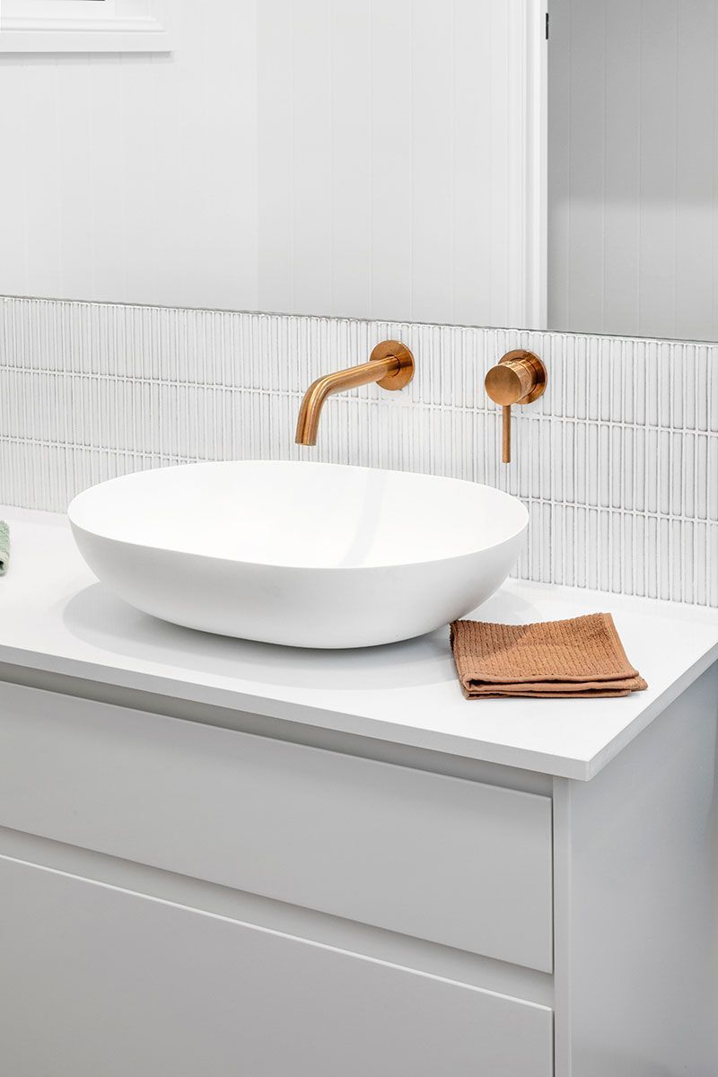 a bathroom with a sink and a towel on the counter .