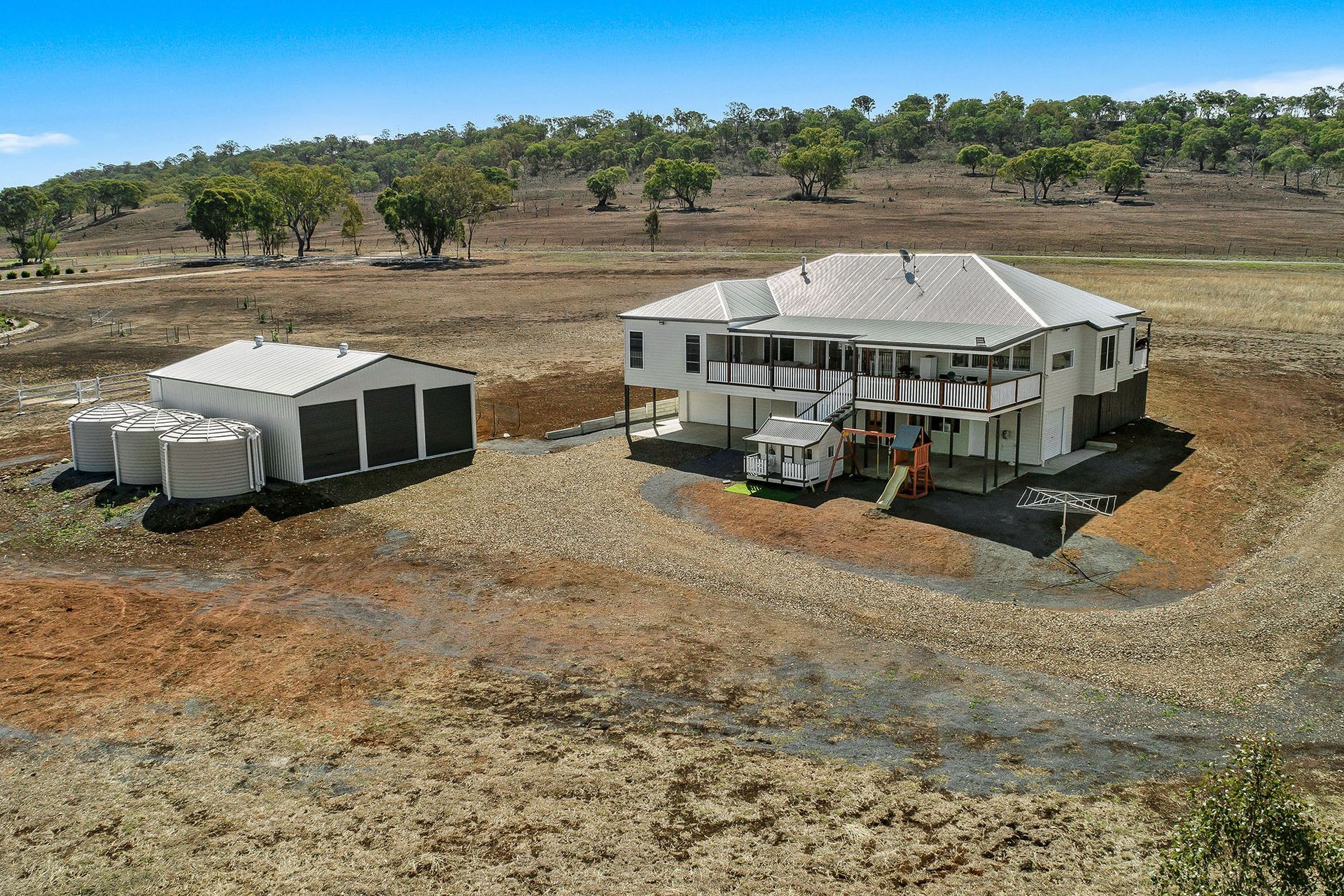 an aerial view of a house in the middle of a field .