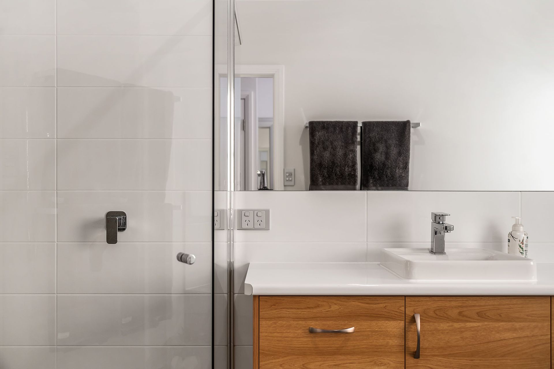 a bathroom with a sink , toilet and shower .