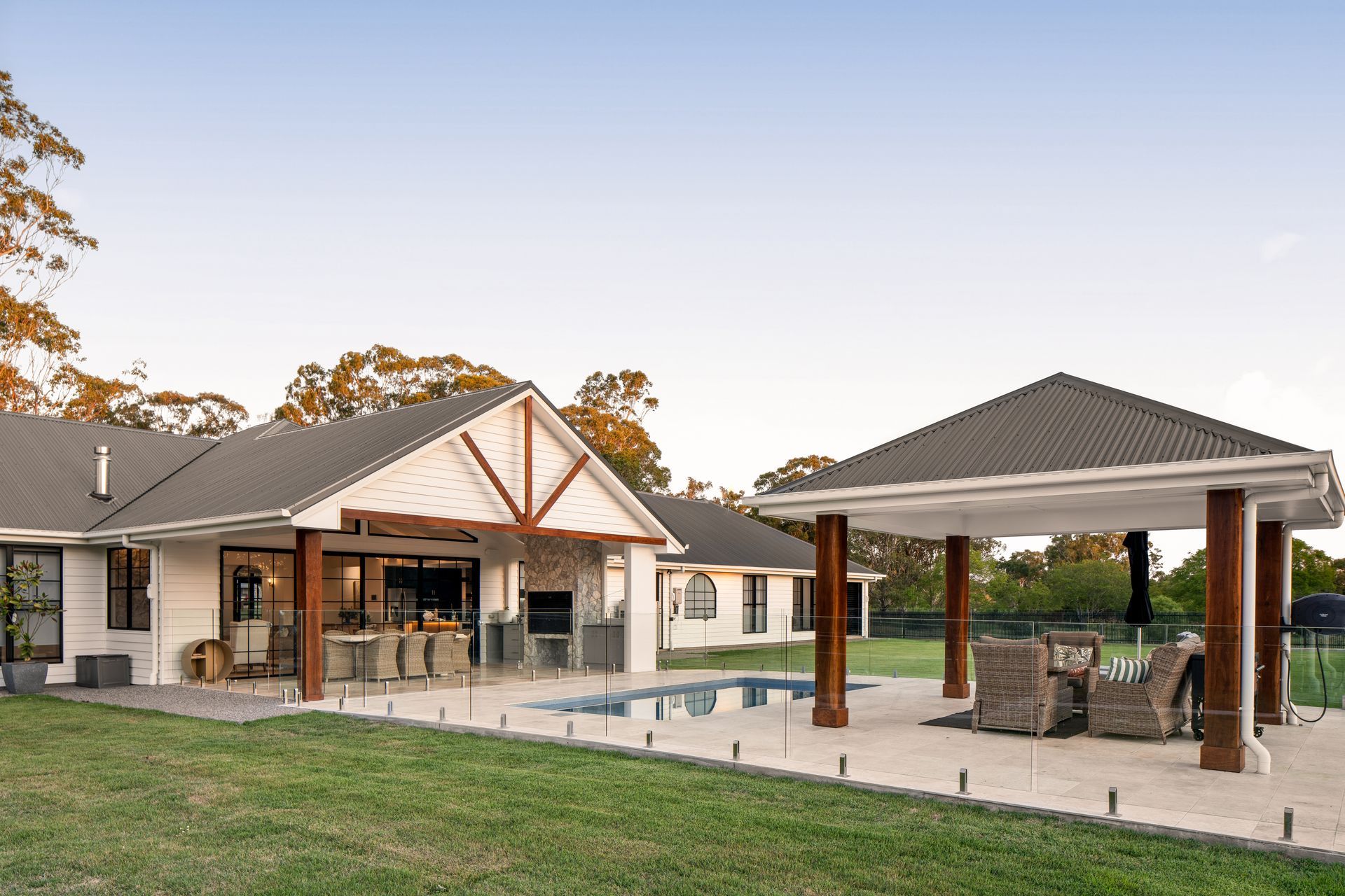a large house with a pool and a gazebo in the backyard .