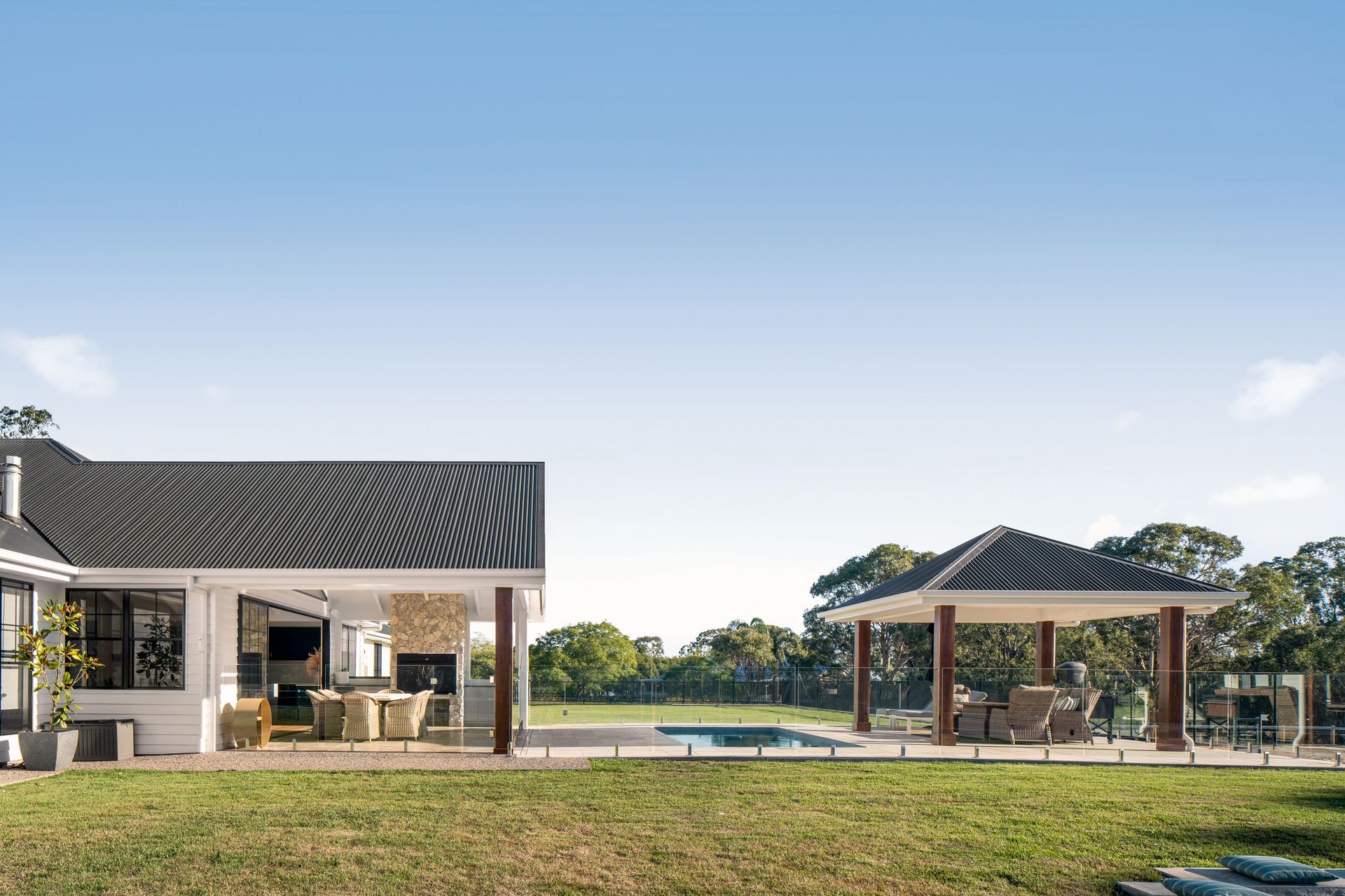 a large house with a pool and a gazebo in the backyard .