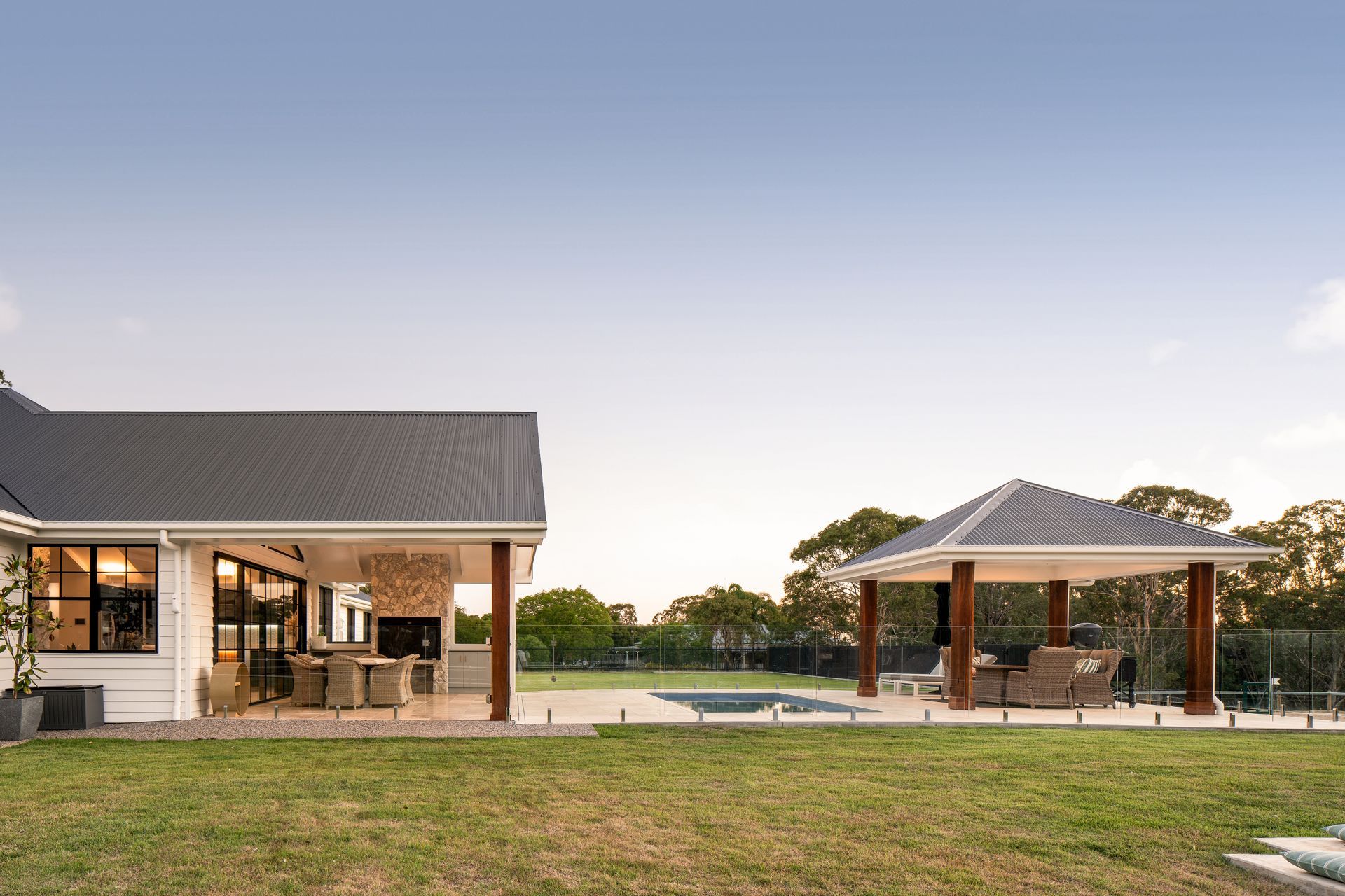 a house with a gazebo and a swimming pool in the backyard .