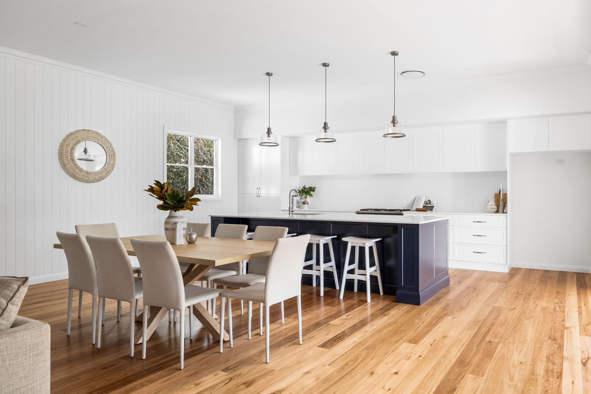 there is a dining table and chairs in the kitchen .