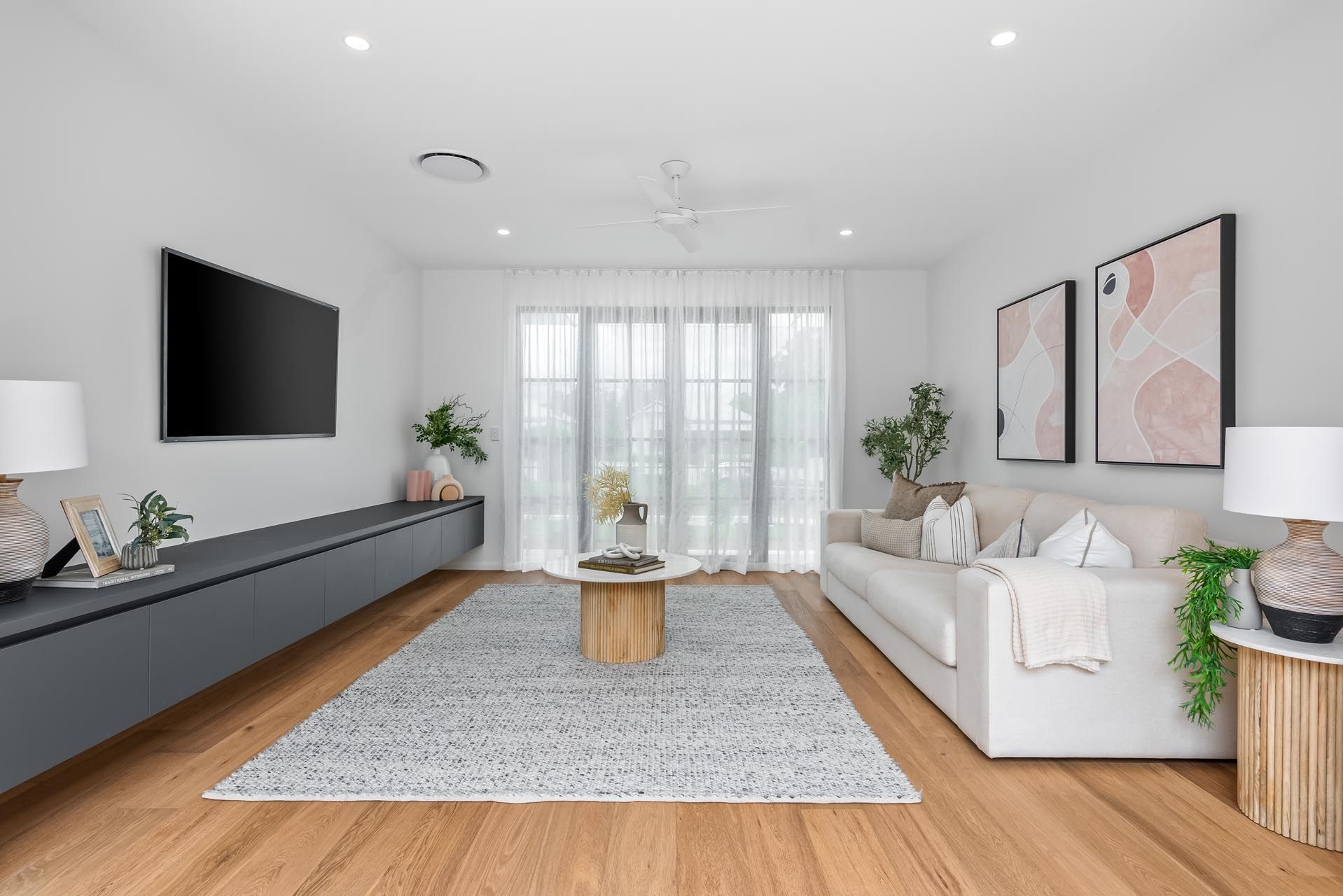 A living room with a couch , table , and television.