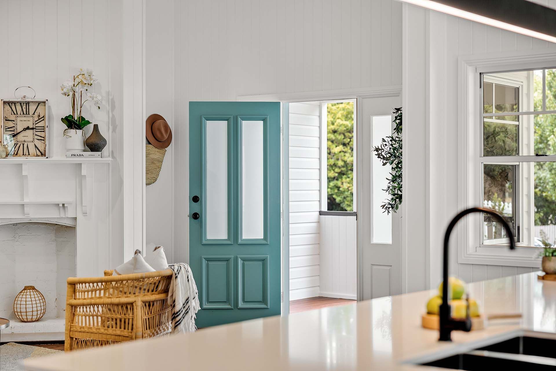 a kitchen with a blue door and a sink .