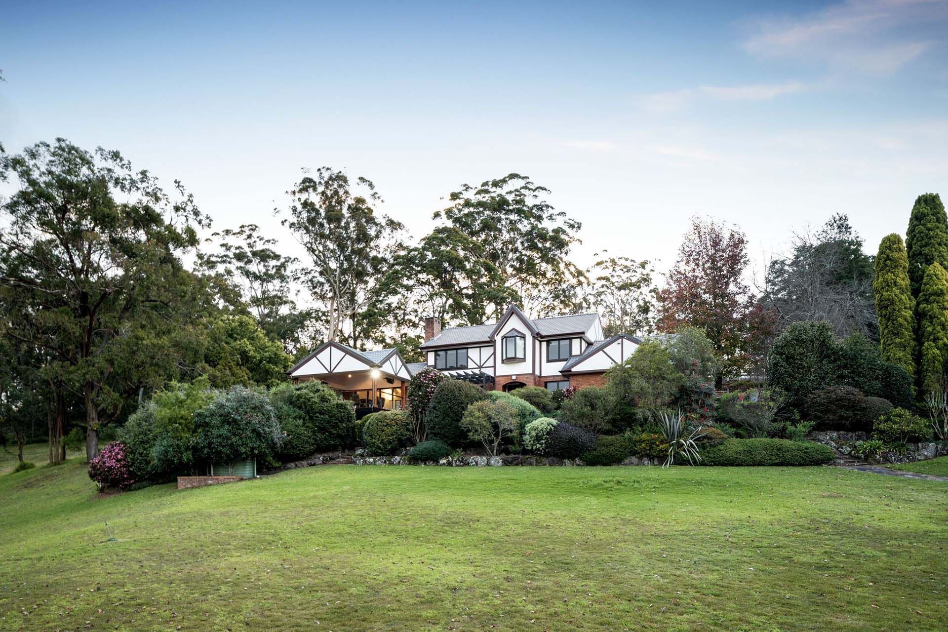 a large house with a large lawn in front of it
