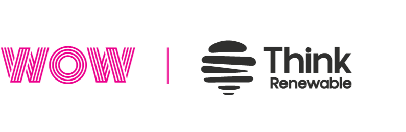Overhead view of two people working at a curved counter with built-in lights, plants below.