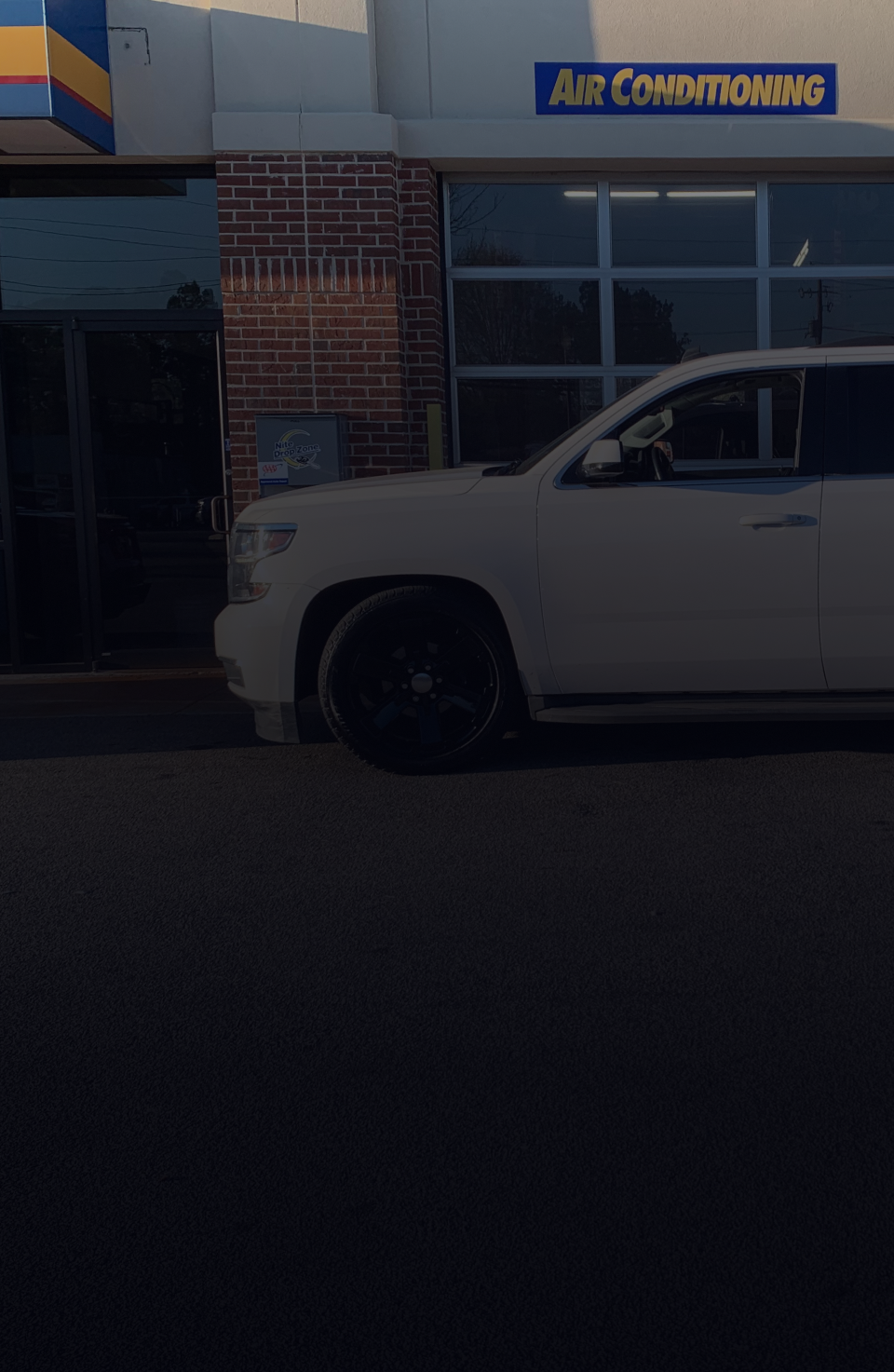 A white car is parked | Dawson's Auto Care