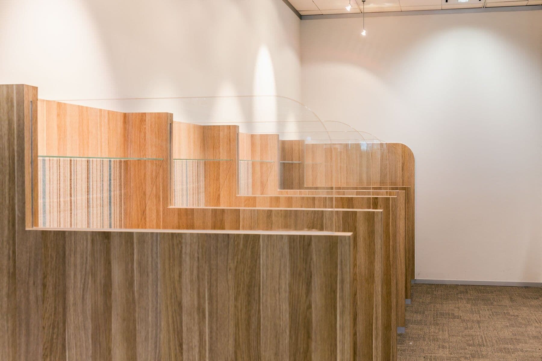 A Row Of Wooden Dividers With Clear Barriers — PKJ Designs in Unanderra, NSW