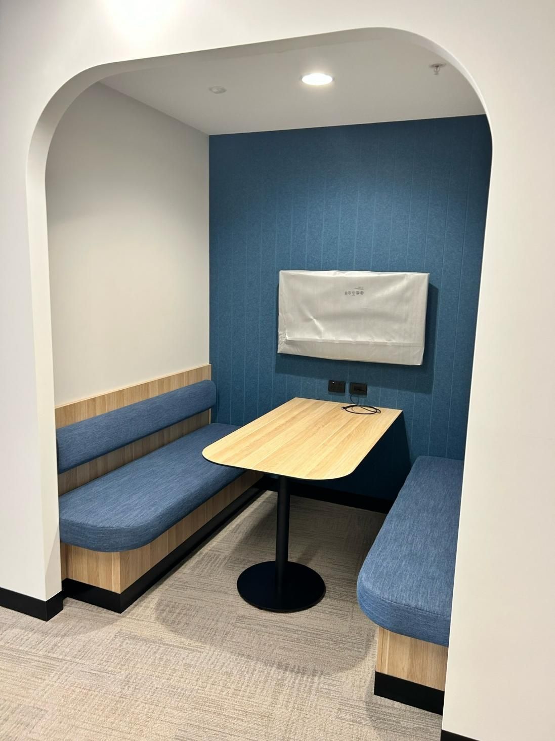 A Small Room With a Table and Benches in It — PKJ Designs in Unanderra, NSW