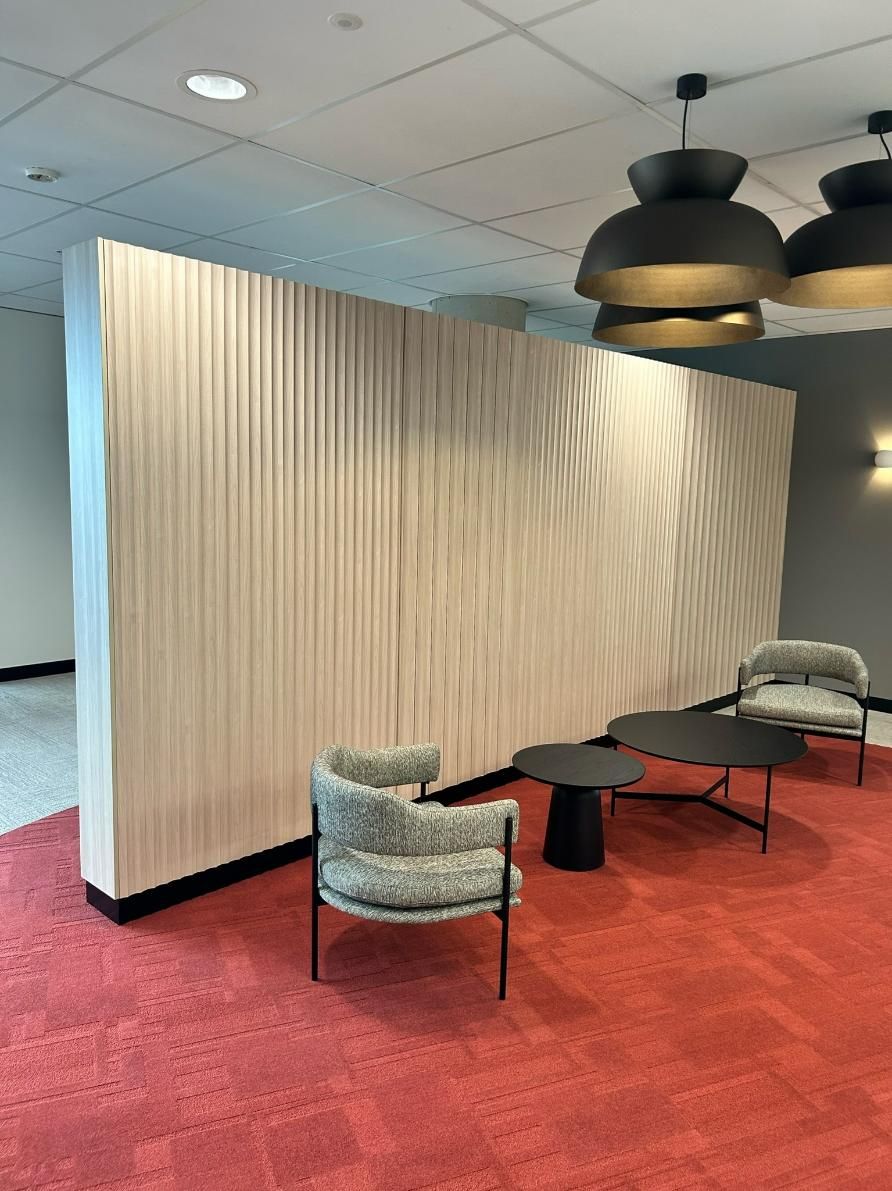 A Room With Chairs and Tables in Front of a Wall — PKJ Designs in Unanderra, NSW