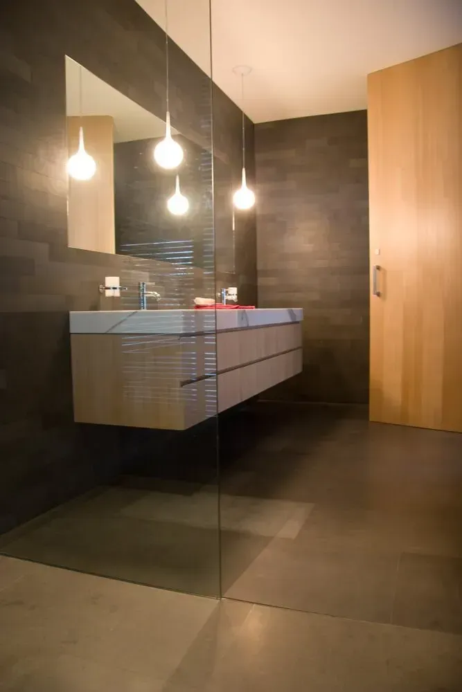 A Bathroom With A Floating Vanity And Downlights — PKJ Designs in Unanderra, NSW