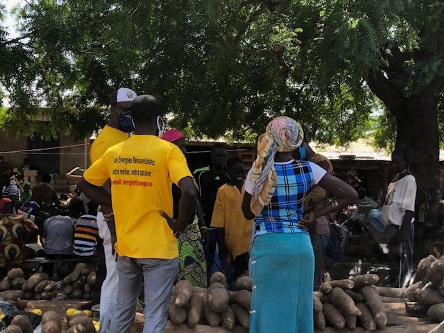 A man wearing a yellow shirt that says ' agriculture ' on it