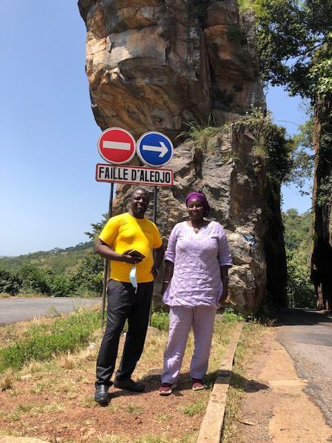 A man and a woman standing in front of a no entry sign