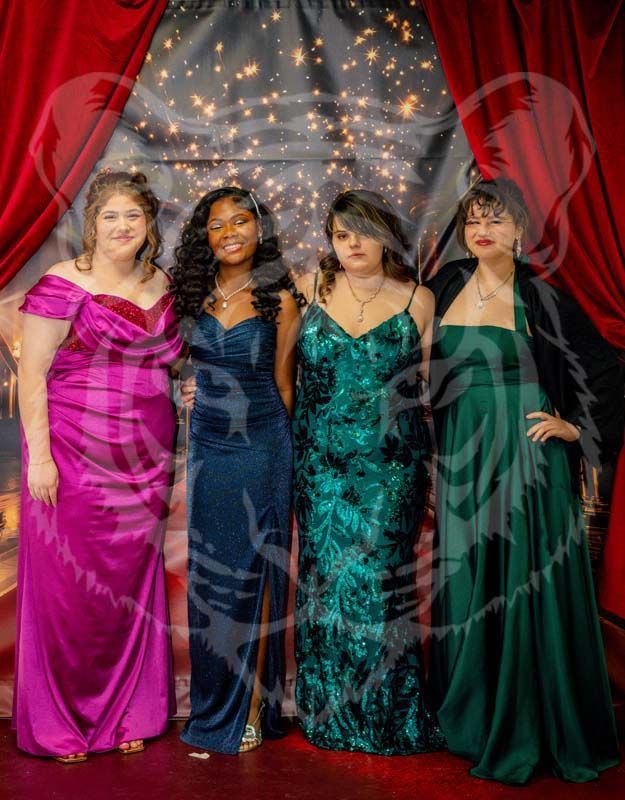 Four people in formal gowns stand side-by-side in front of a red curtain and a dark, starry backdrop.