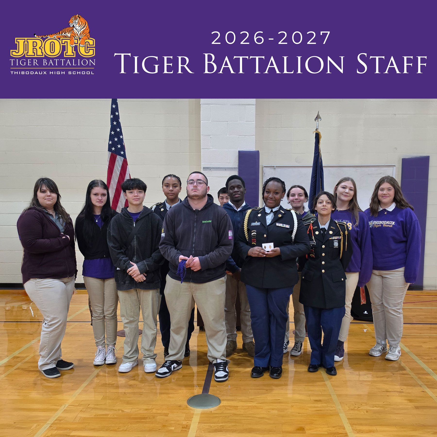 2026–2027 Tiger Battalion Staff posing in a gym, with school logo and American flag background